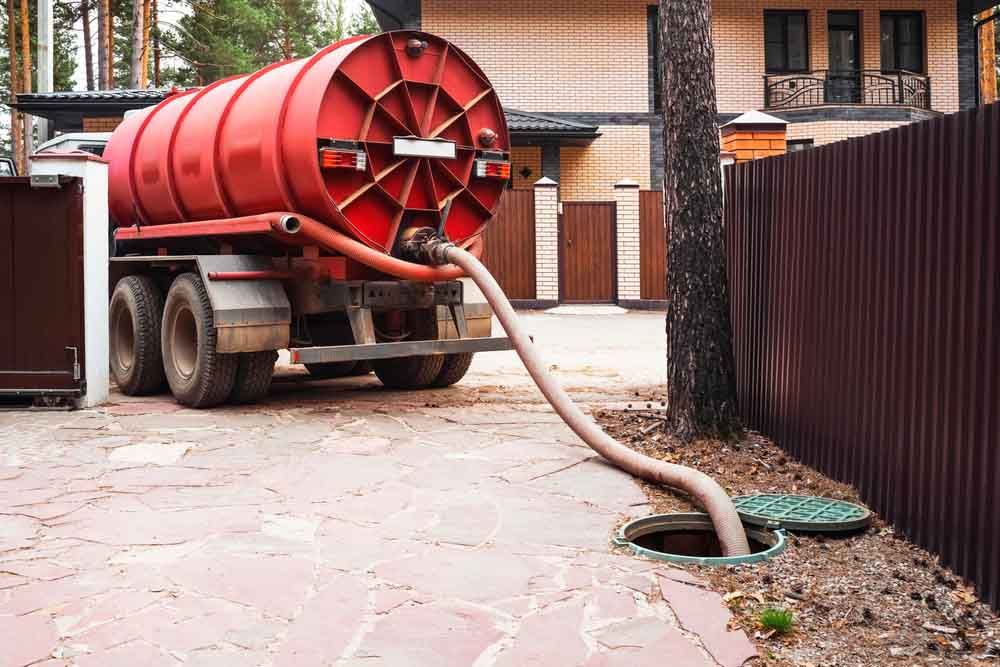 Septic tank being checked/cleaned/pumped Septic tank being checked/cleaned/pumped