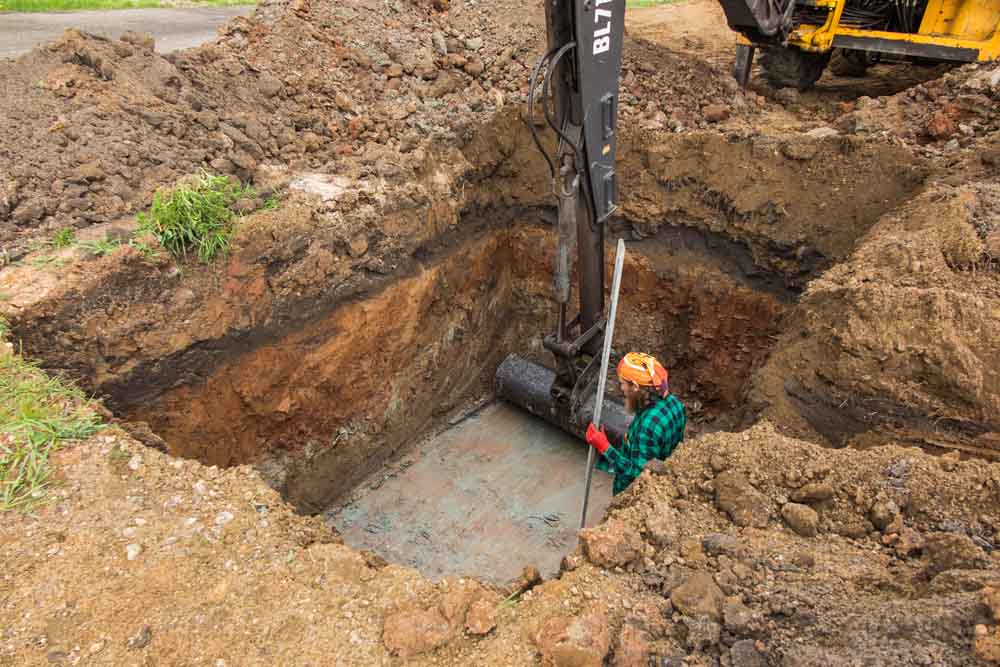 property being excavated for septic tank installation