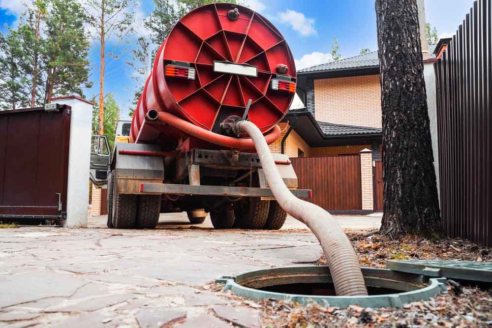 septic tank pumping process in progress